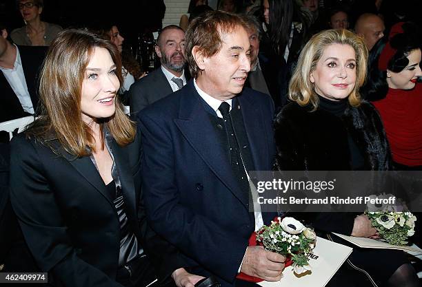 Carla Bruni-Sarkozy, Gilles Dufour and Catherine Deneuve attend the Jean Paul Gaultier show as part of Paris Fashion Week Haute Couture Spring/Summer...