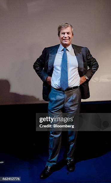 Vincent Bollore, billionaire and chairman of the Bollore Group, poses for a photograph during an Autolib car-sharing scheme news conference in Paris,...