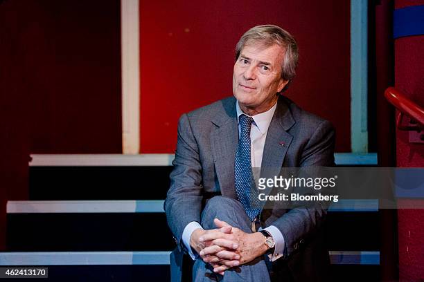 Vincent Bollore, billionaire and chairman of the Bollore Group, poses for a photograph during an Autolib car-sharing scheme news conference in Paris,...