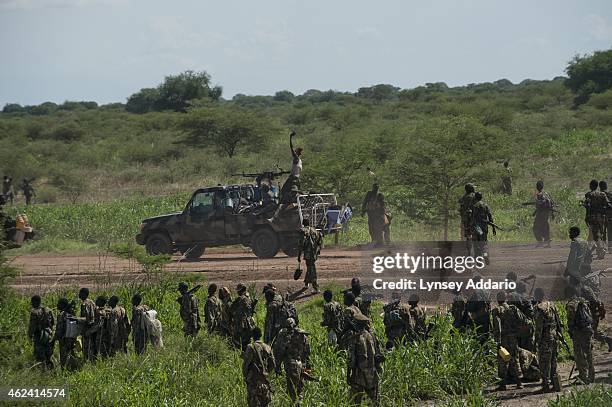 Soldiers with the Sudanese Peoples Liberation Army march towards the town of Bentiu in an effort to retake the town from rebel forces loyal to Riek...