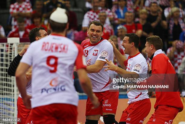 Poland's Bartosz Jurecki celebrates their win with team mates during the 24th Men's Handball World Championships quarterfinals match between Poland...