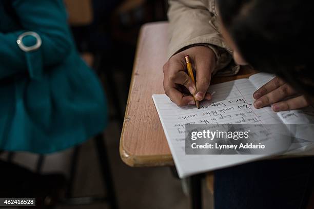 Syrian refugees live in a tented settlement in Turbide in the Bekaa Valley, Lebanon, March 14, 2014. Syrian refugee children attend an afternoon...