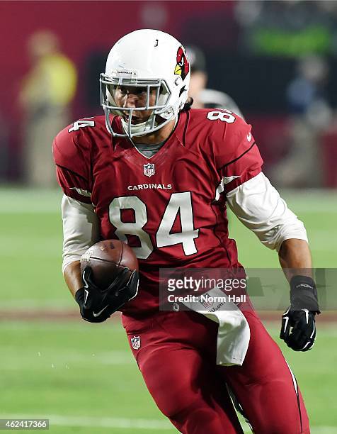 Rob Housler of the Arizona Cardinals runs with the ball against the Seattle Seahawks at University of Phoenix Stadium on December 21, 2014 in...