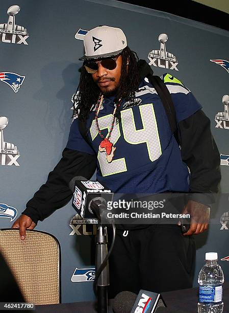 Running back Marshawn Lynch of the Seattle Seahawks arrives to a Super Bowl XLIX media availability at the Arizona Grand Hotel on January 28, 2015 in...
