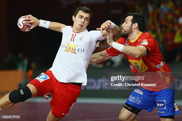 Gedeon Guardiola of Spain defends against Rasmus Lauge Schmidt of Denmark during the quarter final match between Spain and Denmark at Lusail...