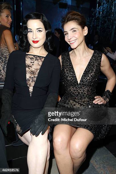 Dita von Teese and Clotilde Courau attend the Elie Saab show as part of Paris Fashion Week Haute Couture Spring/Summer 2015 on January 28, 2015 in...