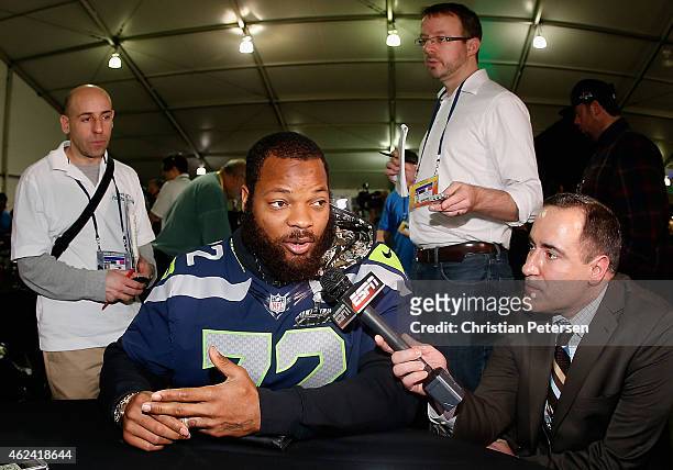 Defensive end Michael Bennett of the Seattle Seahawks speaks during a Super Bowl XLIX media availability at the Arizona Grand Hotel on January 28,...