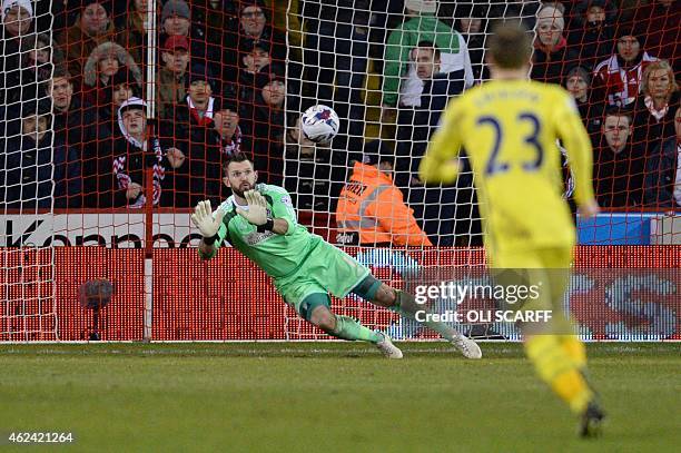 Sheffield United's English goalkeeper Mark Howard saves a shot during the English League Cup semi-final second leg football match between Sheffield...