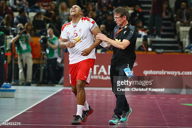 Mads Mensah Larsen of Denmark walks injured from the pitch during the quarter final match between Spain and Denmark at Lusail Multipurpose Hall on...