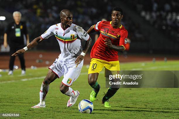 Mustapha Yatabare of Mali vies for the ball against Kevin Constant of Guinea during the Africa Cup of Nations Group D soccer match between Guinea and...