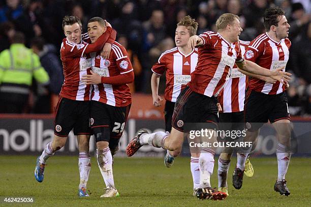 Sheffield United's English forward Che Adams celebrates his and his team's second goal during the English League Cup semi-final second leg football...