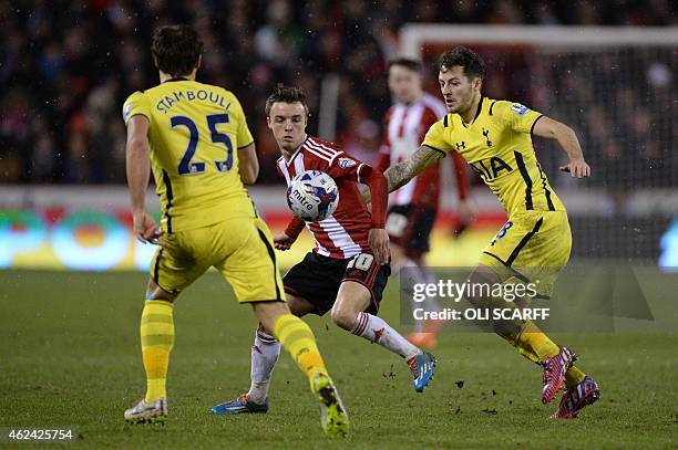 Sheffield United's Scottish midfielder Stefan Scougall battles between Tottenham Hotspur's French midfielder Benjamin Stambouli and Tottenham...