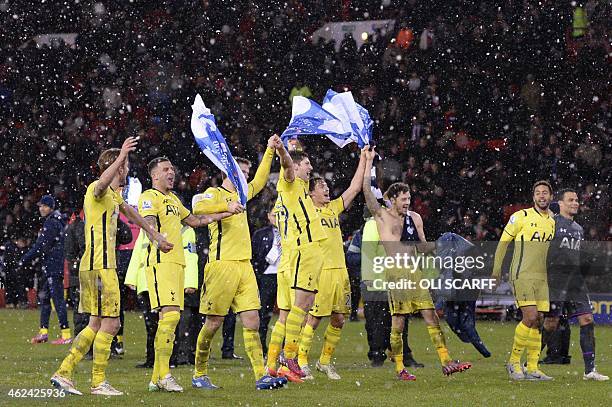 Tottenham players celebrate their victory after the final whistle in the English League Cup semi-final second leg football match between Sheffield...