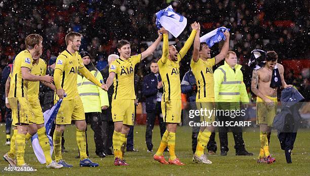 Tottenham players celebrate their victory after the final whistle in the English League Cup semi-final second leg football match between Sheffield...