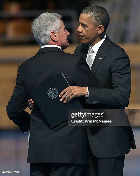 Secretary of Defense Chuck Hagel and U.S. President Barack Obama embrace during a farewell ceremony for Hagel at Fort Myer January 28, 2015 in...