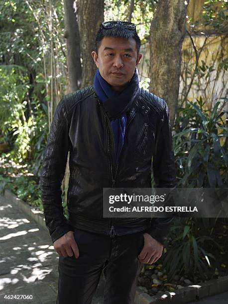 Chinese artist Liu Bolin gestures during an interview at the Fundacion Pedro Meyer in Mexico City on January 28, 2015. AFP PHOTO /ALFREDO ESTRELLA