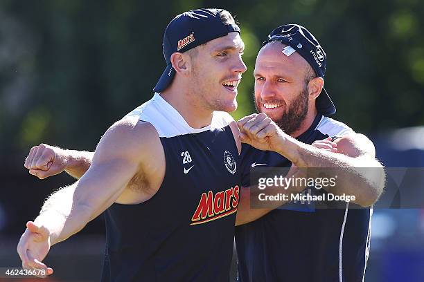 Chris Judd and Tom Bell react during a Carlton Blues AFL pre-season training sessions on January 29, 2015 in Mansfield, Australia.