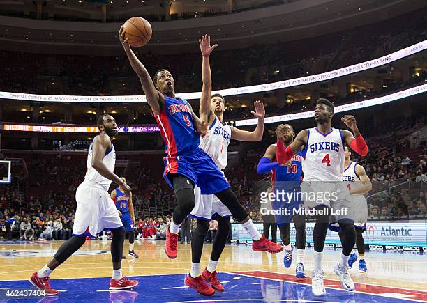 Kentavious Caldwell-Pope of the Detroit Pistons attempts a layup woth Michael Carter-Williams and Nerlens Noel of the Philadelphia 76ers defending on...
