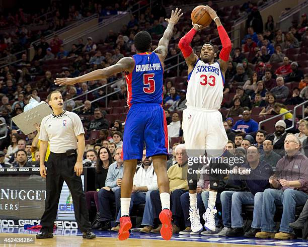 Robert Covington of the Philadelphia 76ers attempts a shot with Kentavious Caldwell-Pope of the Detroit Pistons defending on the play on January 28,...