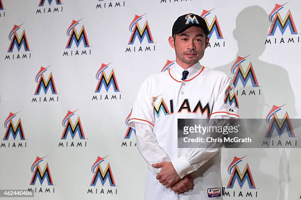 Ichiro Suzuki poses for photographers wearing a Miami Marlins uniform during the press conference at the Capitol Hotel Tokyu on January 29, 2015 in...