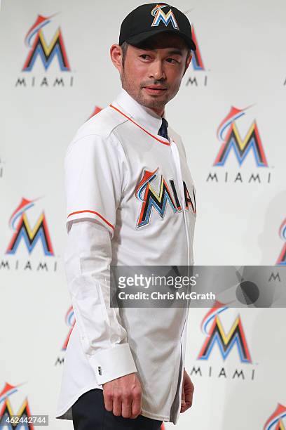 Ichiro Suzuki poses for photographers wearing a Miami Marlins uniform during the press conference at the Capitol Hotel Tokyu on January 29, 2015 in...