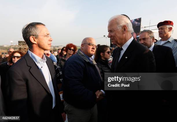 Vice President Joe Biden consoles Omri Sharon and Gilad Sharon , the sons of former Israeli Prime Minister Ariel Sharon, during their father's...