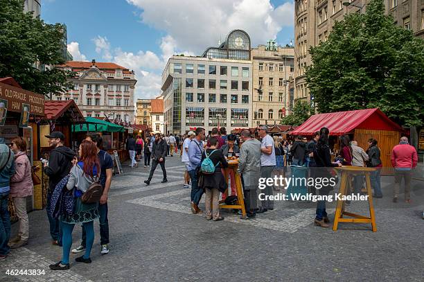 People eating street food on Wenceslas Square which is one of the main city squares and the center of the business and cultural communities in the...