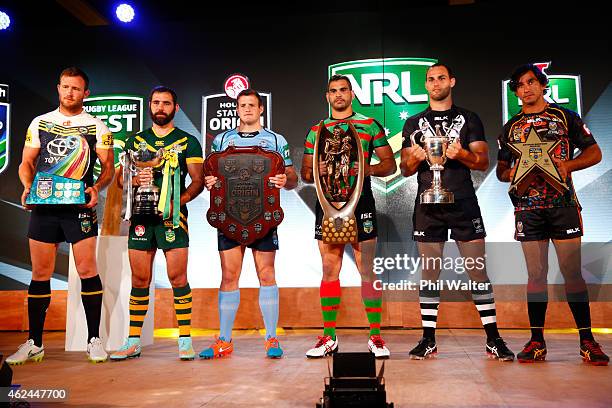Gavin Cooper, Cameron Smith, Josh Morris, Greg Inglis, Simon Mannering and Johnathan Thurston hold their respective trophies during the 2015 NRL...