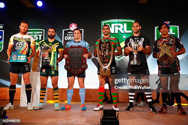 Gavin Cooper, Cameron Smith, Josh Morris, Greg Inglis, Simon Mannering and Johnathan Thurston hold their respective trophies during the 2015 NRL...