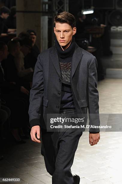 Model walks the runway during the Marras show as a part of Milan Fashion Week Menswear Autumn/Winter 2014 on January 13, 2014 in Milan, Italy.