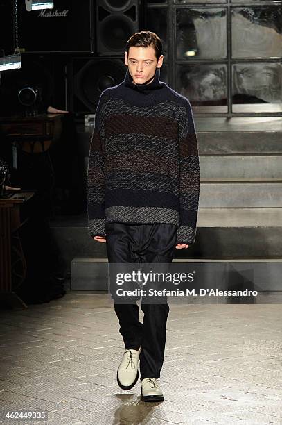 Model walks the runway during the Marras show as a part of Milan Fashion Week Menswear Autumn/Winter 2014 on January 13, 2014 in Milan, Italy.