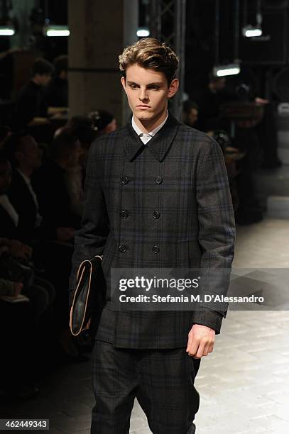 Model walks the runway during the Marras show as a part of Milan Fashion Week Menswear Autumn/Winter 2014 on January 13, 2014 in Milan, Italy.