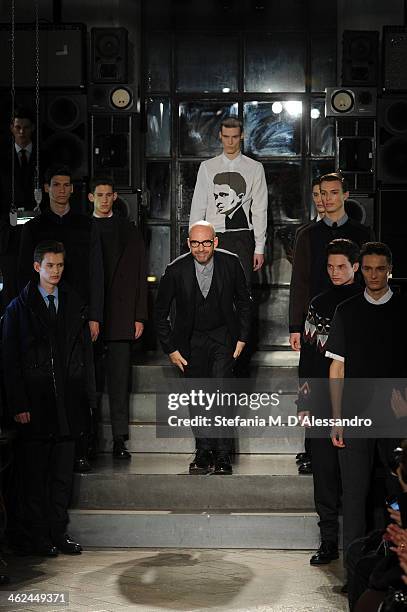 Designer Antonio Marras acknowledges the audience at the end of the Marras show as a part of Milan Fashion Week Menswear Autumn/Winter 2014 on...