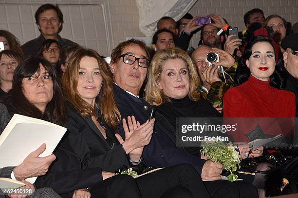 Emmanuelle Alt, Carla Bruni Sarkozy, Gilles Dufour, Catherine Deneuve and Dita Von Teese attend the Jean Paul Gaultier show as part of Paris Fashion...