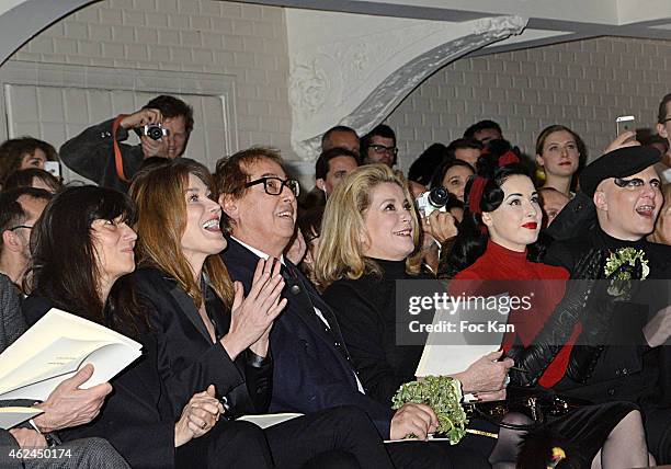 Emmanuelle Alt, Carla Bruni Sarkozy, Gilles Dufour, Catherine Deneuve, Dita Von Teese and Ali Mahdavi attend the Jean Paul Gaultier show as part of...