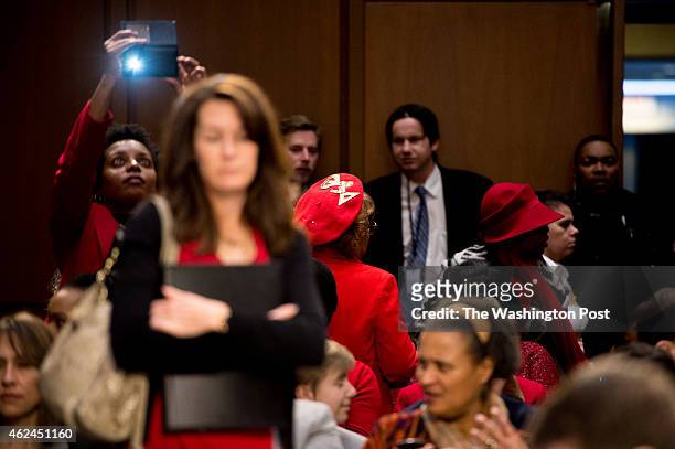 Members of the Delta Sigma Theta Sorority, dressed in red, appear in the audience before U.S. Attorney general nominee Loretta Lynch appears for her...