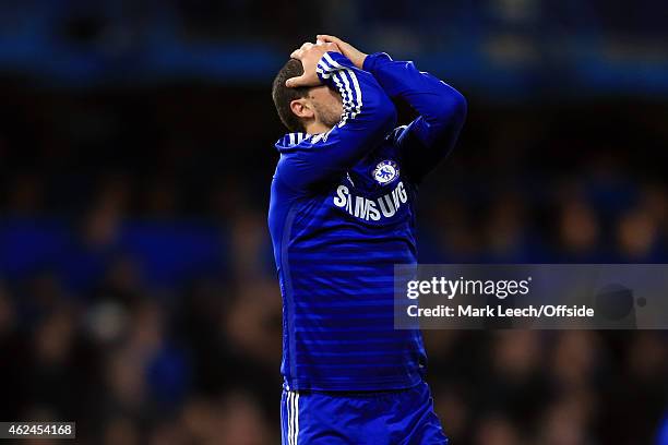 Eden Hazard of Chelsea reacts to missing a shot during the Capital One Cup Semi-Final second leg between Chelsea and Liverpool at Stamford Bridge on...