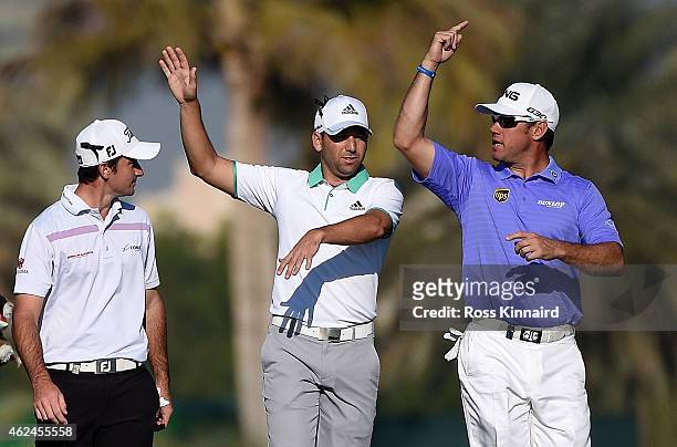 Gary Stal of France chatting with Sergio Garcia of Spain and Lee Westwood of England on the par five 13th hole during the first round of the Omega...
