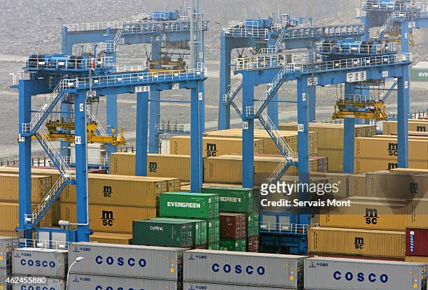 March 22: Cosco containers, among others, wait to be loaded on ships in Ningbo port on March 22, 2006 in Zhejiang province, China. Cosco stands for...