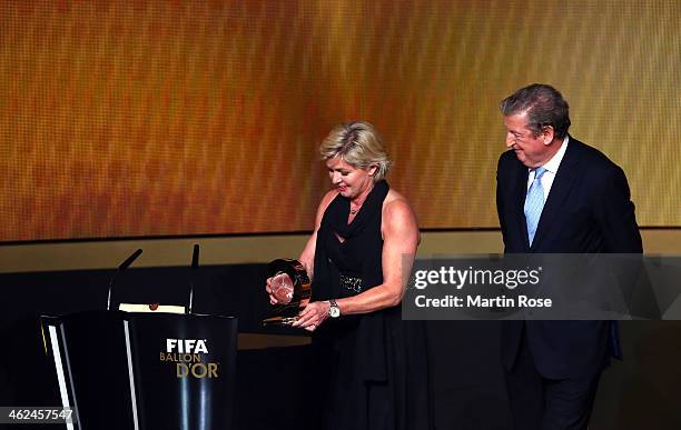 Silvia Neid of Germany receives the FIFA women's coach of the year trophy during the FIFA Ballon d'Or Gala 2013 at the Kongresshalle on January 13,...