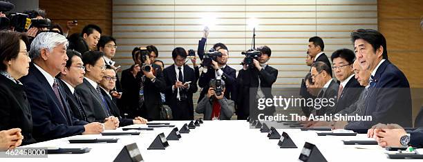 Japanese Prime Minister Shinzo Abe speaks during the his meeting with state ministers concerning the hostage crisis at Abe's official residence on...