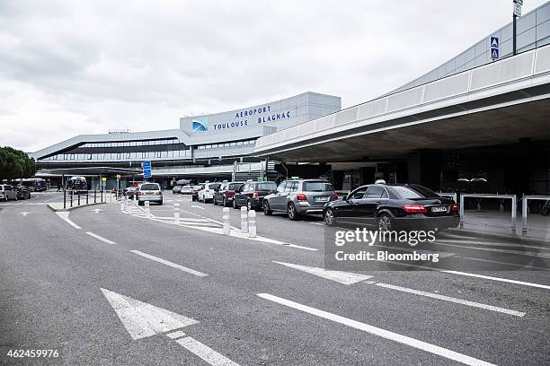 Automobiles sit in a taxi rank outside Toulouse-Blagnac airport in Toulouse, France, on Wednesday, Jan. 28, 2015. While Club Mediterranee SA may...