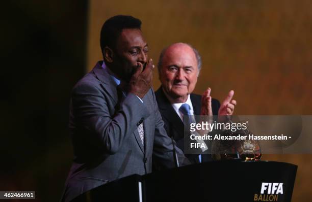 Pele of Brazil wipes tears from his eyes after receiving the FIFA Ballon d'Or Prix d'Honneur award from FIFA President Joseph S. Blatter during the...