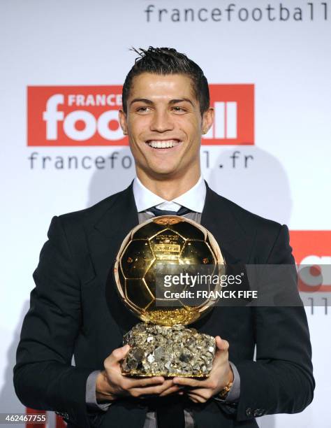 Manchester United Portuguese winger Cristiano Ronaldo holds his trophy after he received the European footballer of the year award, the "Ballon d'Or"...