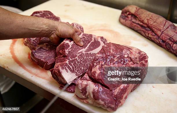 Robert Laurenzo prepares cuts of beef at Laurenzo's Italian Center on January 13, 2014 in North Miami Beach, Florida. Although the store has been...