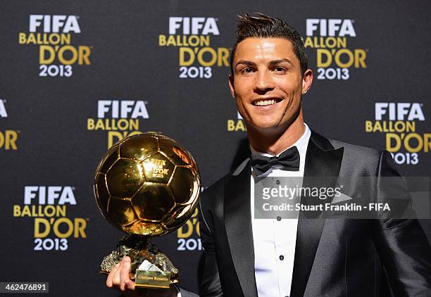 Ballon d'Or winner Cristiano Ronaldo of Portugal and Real Madrid poses with his award after the FIFA Ballon d'Or Gala 2013 at the Kongresshaus on...