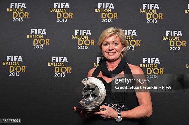 World Coach of the Year for Women's Football winner and manager of the Germany women's team Silvia Neid poses with her award after the FIFA Ballon...
