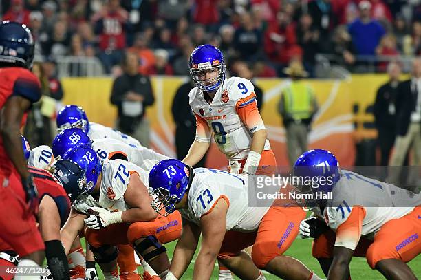Grant Hedrick of the Boise State Broncos calls out signals at the line of scrimmage against the Arizona Wildcats at University of Phoenix Stadium on...