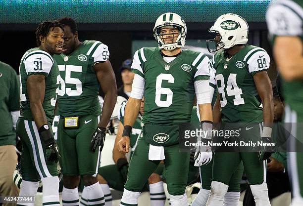 New York Jets against the New England Patriots at MetLife Stadium. Jets cornerback Antonio Cromartie talks to Jets quarterback Mark Sanchez on the...