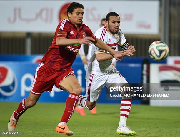 Zamalek's Hazem Emam vies for the ball against Al-Ahly's Saad Samir during their Egyptian Premier League football match at the 30 June Air Defence...